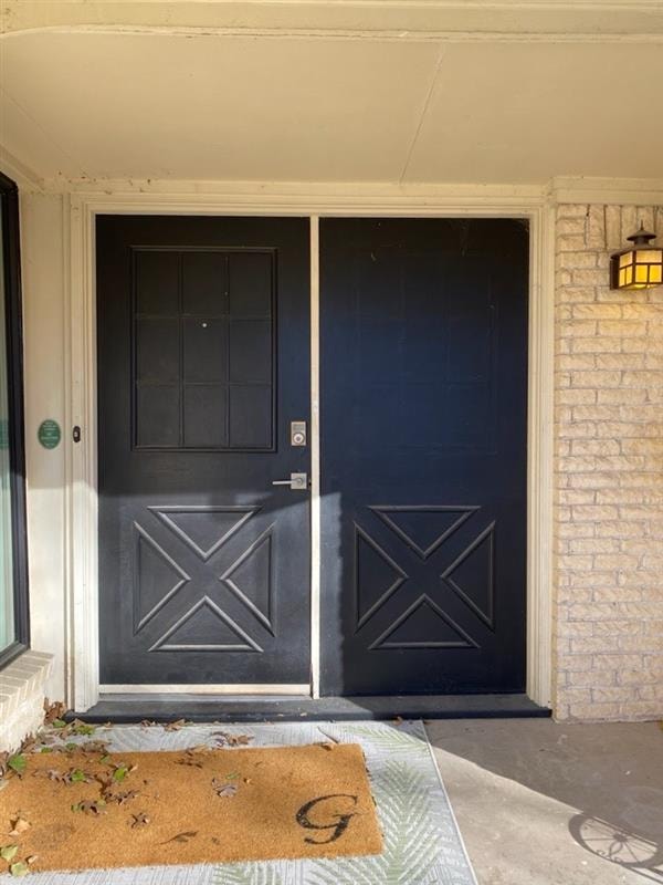 Entryway before — original X-panel doors