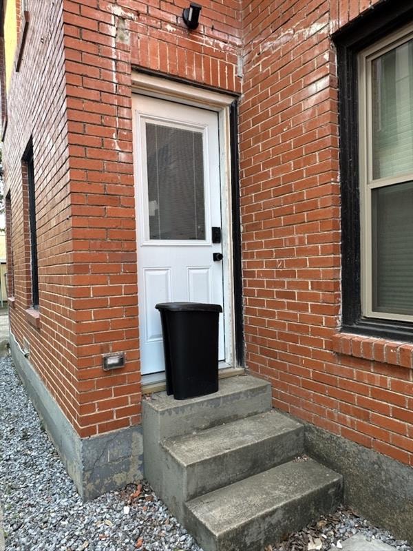 Exterior steps before — no railing